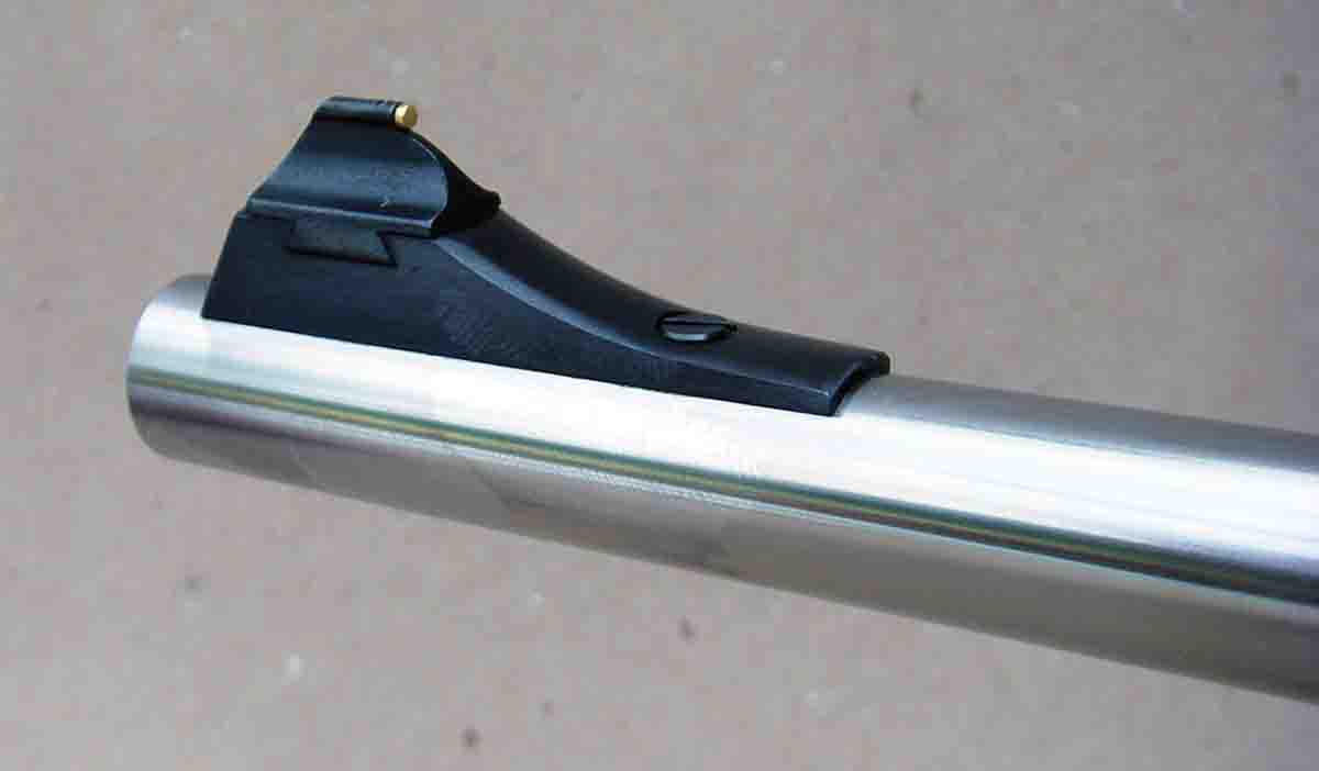 The front sight features a base with a dovetail slot for interchangeability.